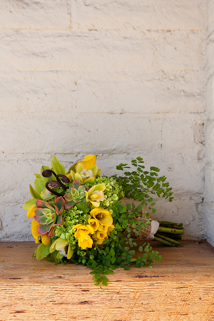 An image of the yellow flower and succulent bouquet from the Sherman Garden Wedding