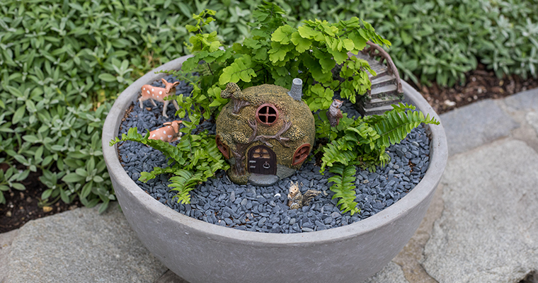 An image of a miniature house, animals and plants for mini garden