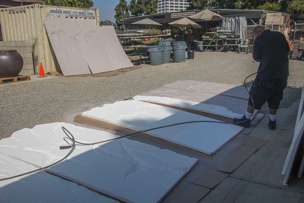 blogimage12 An image of a team member painting the Hogwarts castle walls Halloween 2018