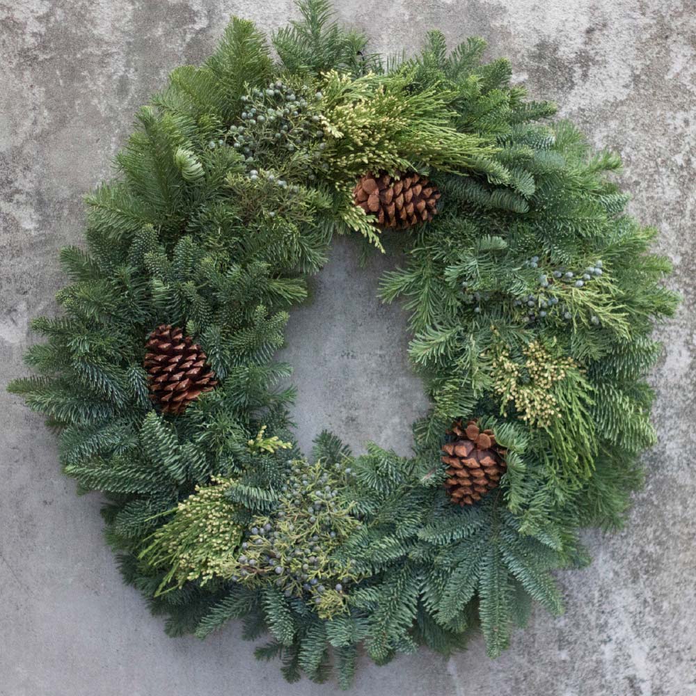 mixed-cones An image of a green mixed pinecone wreath