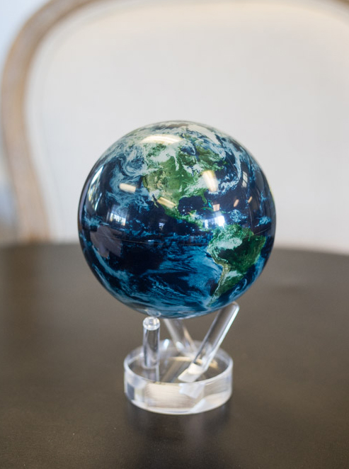 An image of a glass blue, white and green globe