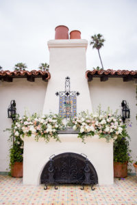 An image of a floral decorated fireplace for the Herbert Wedding