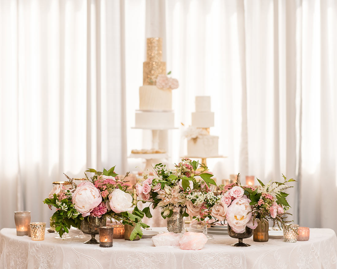 An image of multiple pink rose arrangement for a wedding