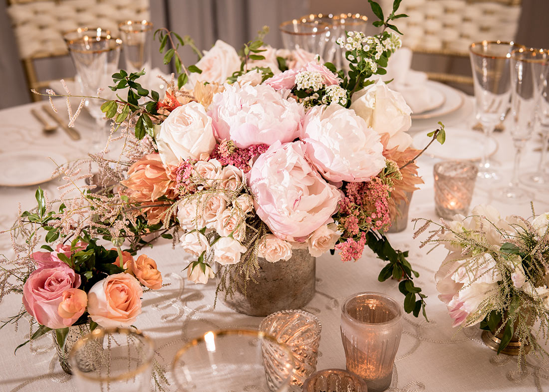 An image of a floral wedding arrangement with light pink roses