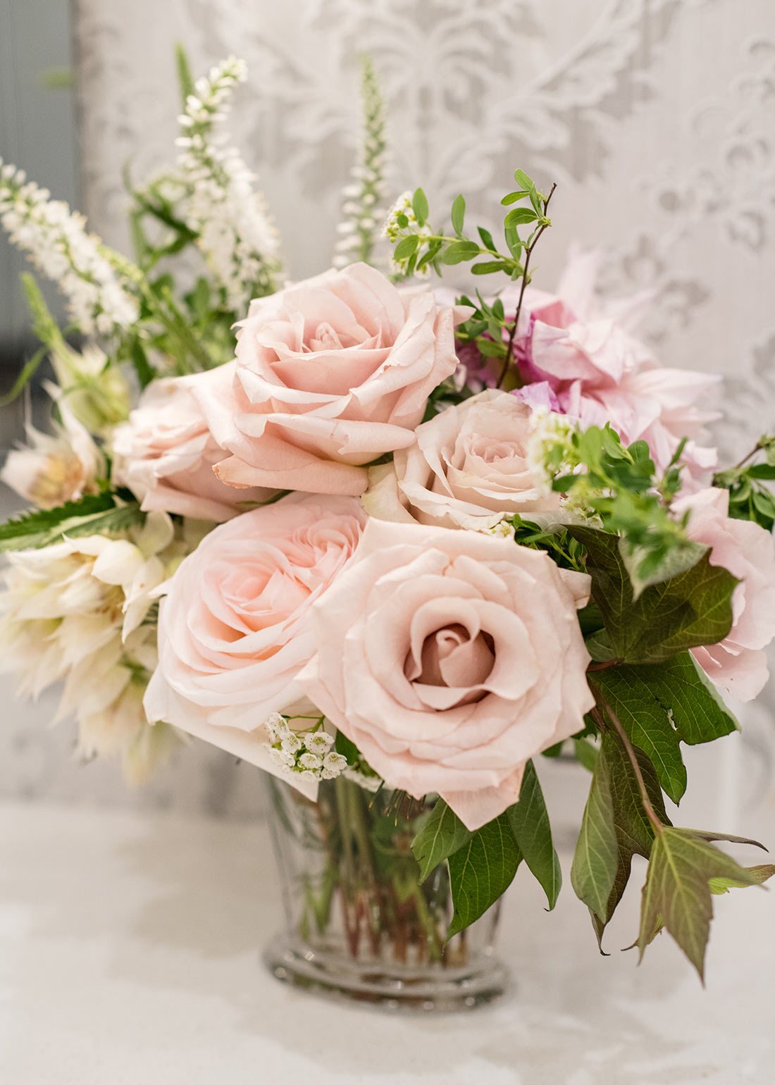 An image of light pink roses floral wedding arrangement with light pink roses