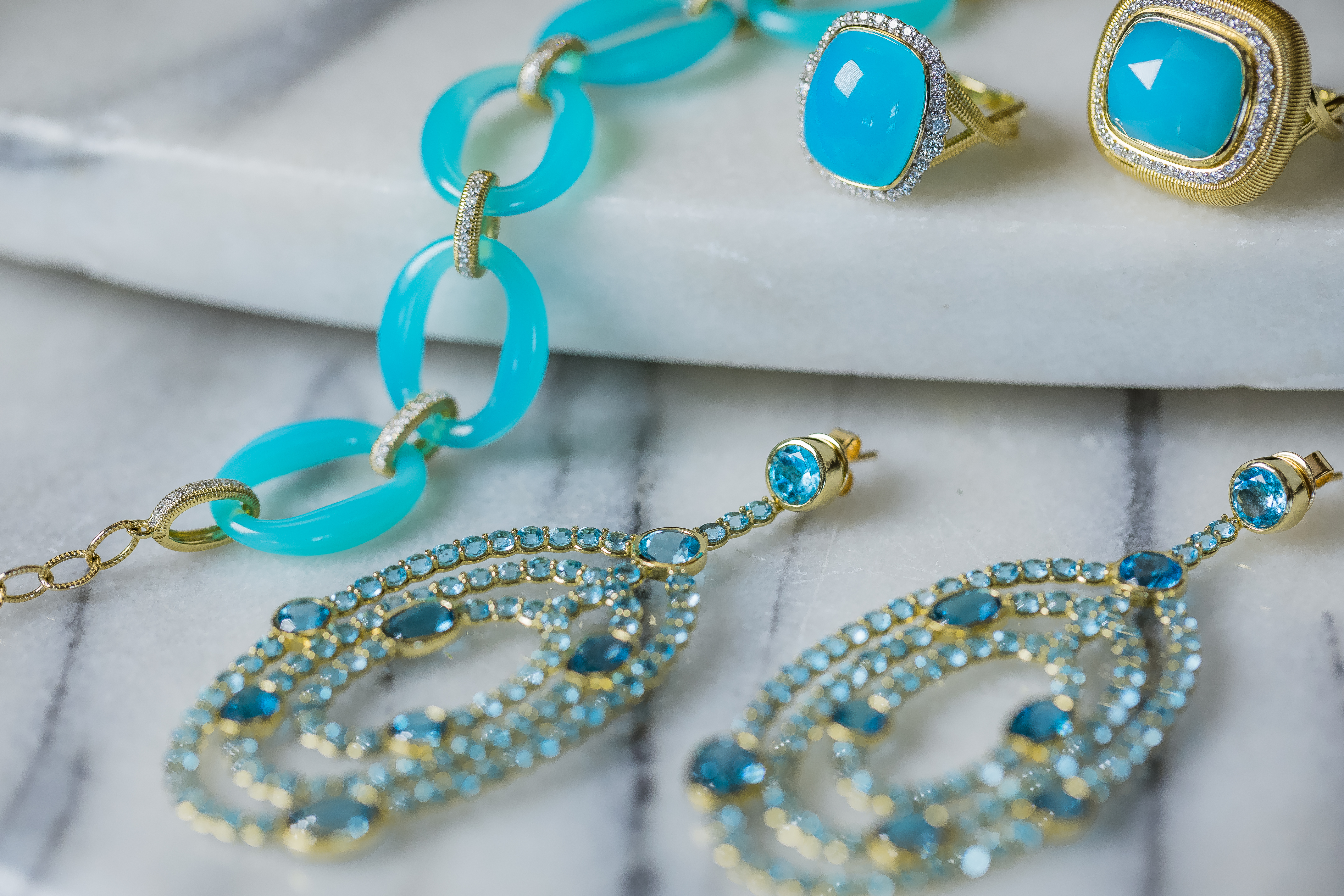 An image of aqua blue topaz gold jewelry from the Gadbois Glory "Spring Vibe"
