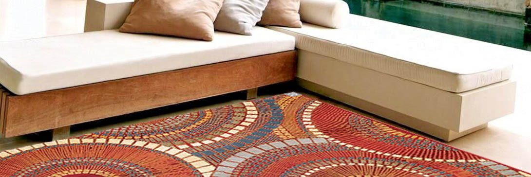 rug_couch An image of a cream colored sectional and a rust patterned rug